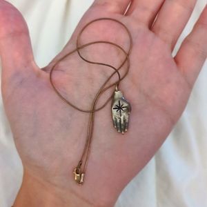 Star in hand pendant with snake choker chain
